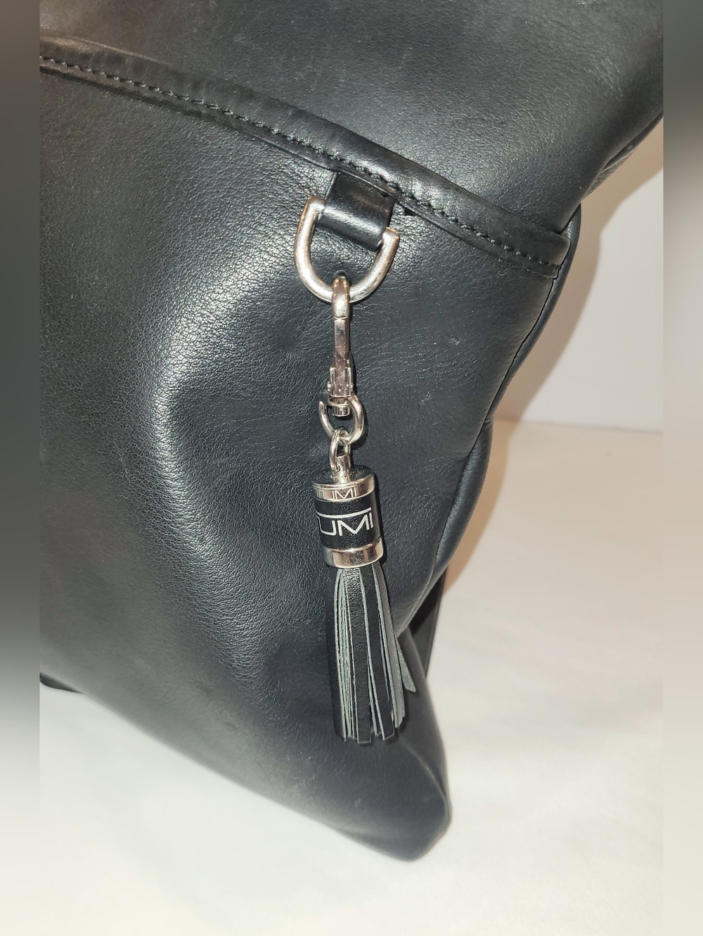 Tumi Black Leather Crossbody with Tassel Charm - Picture 2 of 9